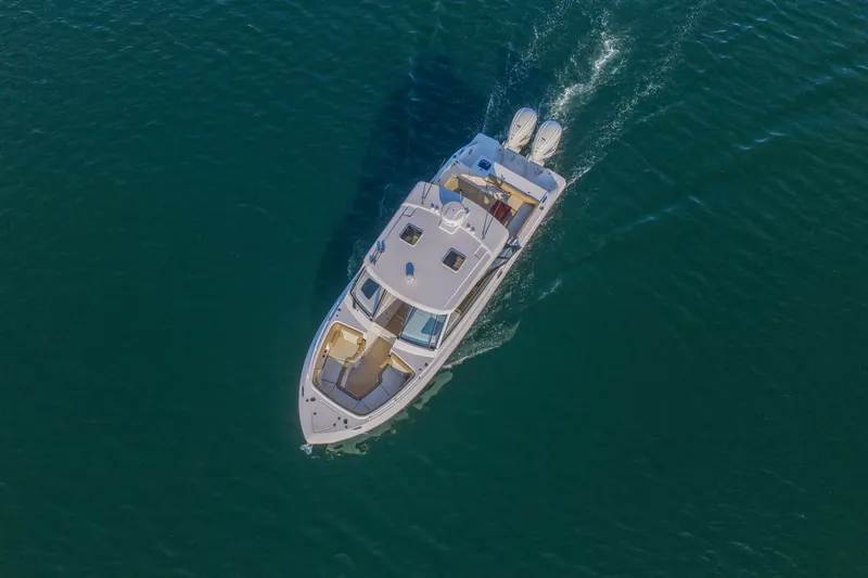 Slide: The Image of Aerial view of 2023 Everglades 340 Dual Console boat cruising on open water. - 56