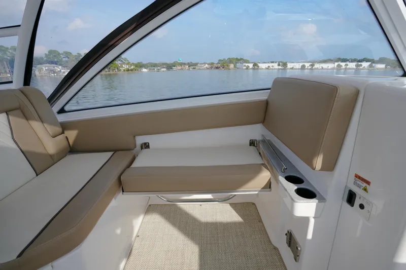 Slide: The Image of Dashboard of 2023 Everglades 340 Dual Console with Garmin navigation displays. - 6