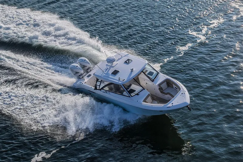 Slide: The Image of 2023 Everglades 340 Dual Console boat cruising on open water. - 60