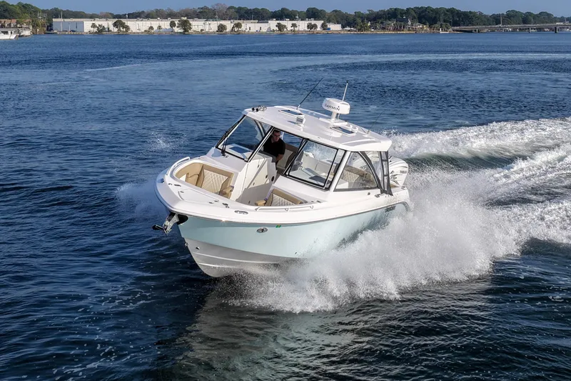 Slide: The Image of 2023 Everglades 340 Dual Console boat cruising on open water. - 62