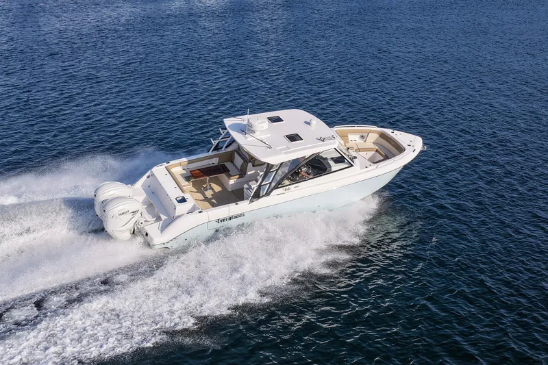 Slide: The Image of 2023 Everglades 340 Dual Console boat cruising on open water. - 66