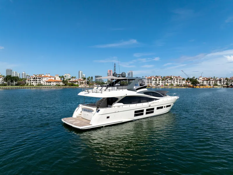 Slide: The Image of Luxury 2016 Astondoa 80 GLX yacht cruising near waterfront cityscape. - 15