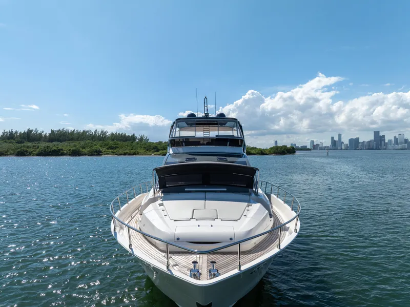 Slide: The Image of Astondoa 80 GLX 2016 yacht on serene water with city skyline in background. - 26