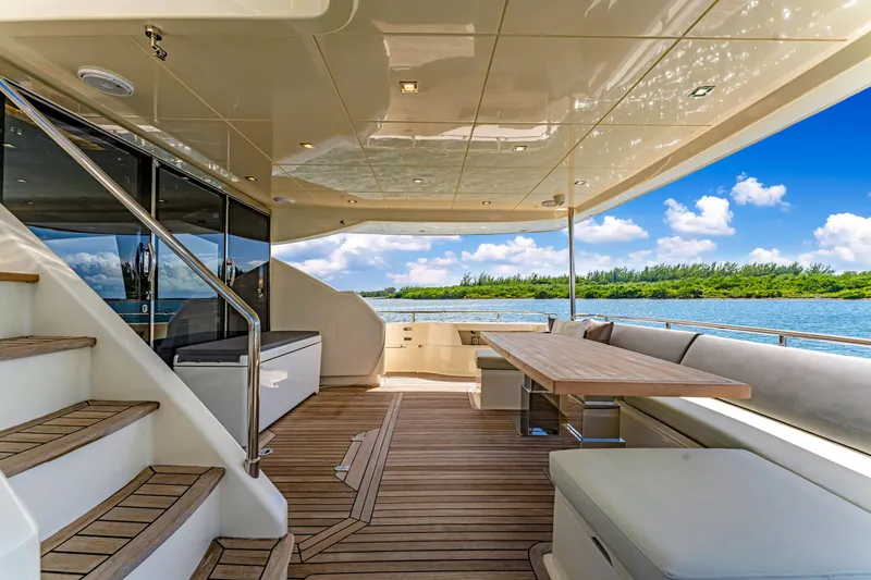 Slide: The Image of Luxurious 2016 Astondoa 80 GLX yacht deck with elegant seating and scenic water view. - 28
