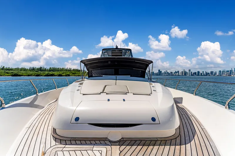 Slide: The Image of Luxury Astondoa 80 GLX yacht on open water, 2016 model, with city skyline backdrop. - 32