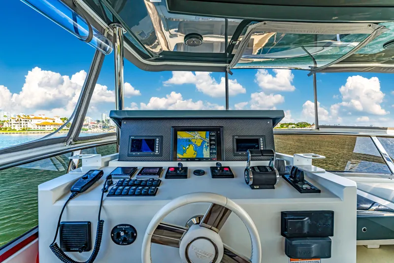 Slide: The Image of Astondoa 80 GLX 2016 yacht helm with navigation controls and scenic ocean view. - 39