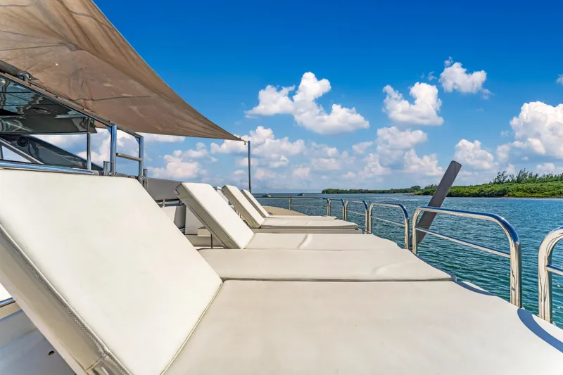 Slide: The Image of Luxurious 2016 Astondoa 80 GLX yacht with sun loungers on deck, under a clear blue sky. - 41