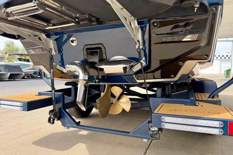 Slide: The Image of 2026 Nautique Super Air Nautique G23 boat stern with propeller and exhaust system. - 10