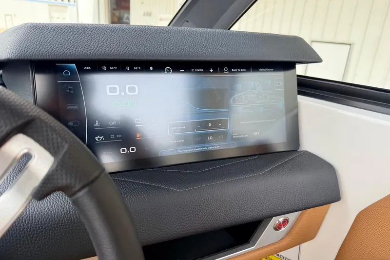 Slide: The Image of 2026 Nautique Super Air Nautique G23 dashboard with advanced digital display and controls. - 19