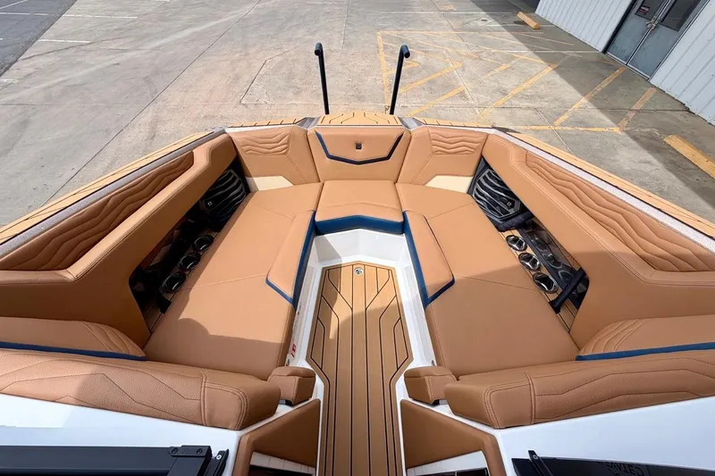 Slide: The Image of Luxurious interior of 2026 Nautique Super Air Nautique G23 boat with tan seating. - 20