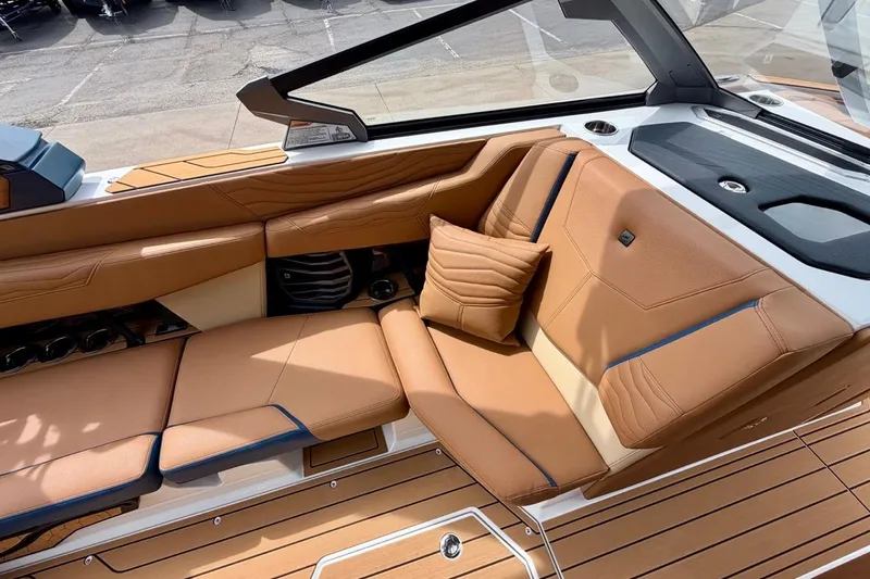 Slide: The Image of Luxurious interior of 2026 Nautique Super Air Nautique G23 with tan leather seating. - 26