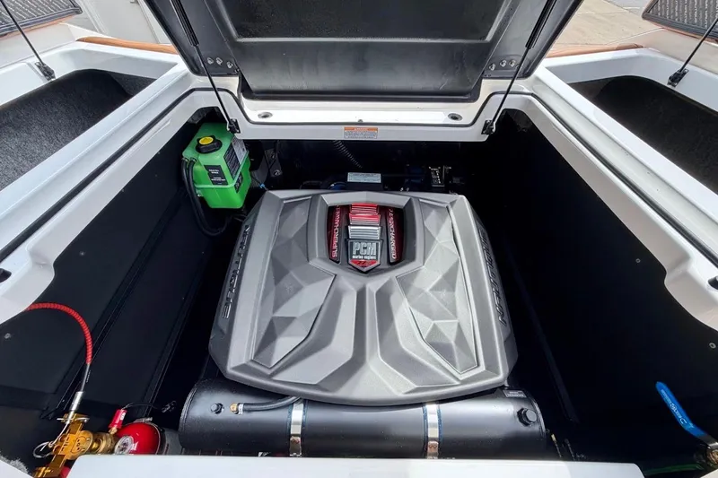 Slide: The Image of 2026 Nautique Super Air Nautique G23 engine compartment with PCM engine and battery. - 36