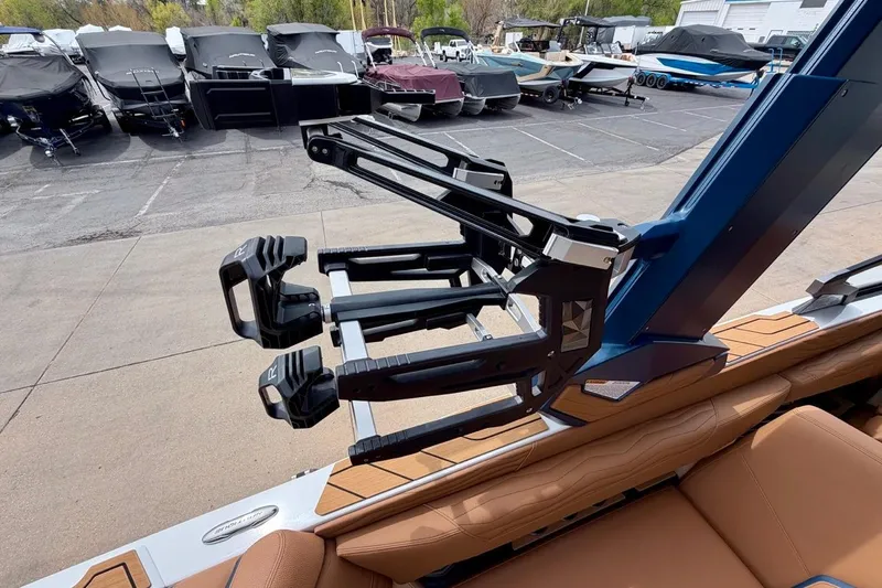 Slide: The Image of 2026 Nautique Super Air Nautique G23 boat with advanced wakeboard rack system. - 38