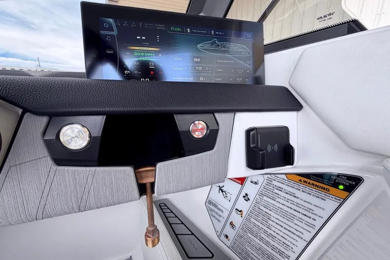 Slide: The Image of 2026 Nautique Ski Nautique dashboard with touchscreen display and control panel. - 19