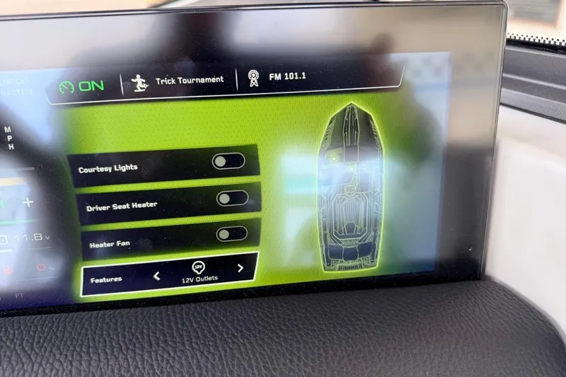 Slide: The Image of 2026 Nautique Ski Nautique dashboard display with control options for lights and seat heater. - 20