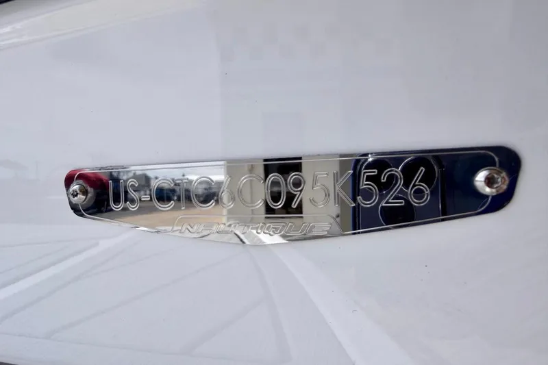 Slide: The Image of 2026 Nautique Ski Nautique boat identification plate with serial number. - 26