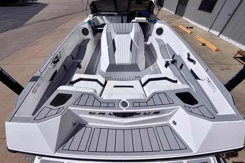 Slide: The Image of 2026 Nautique Ski Nautique boat interior with sleek, modern design and spacious seating. - 9