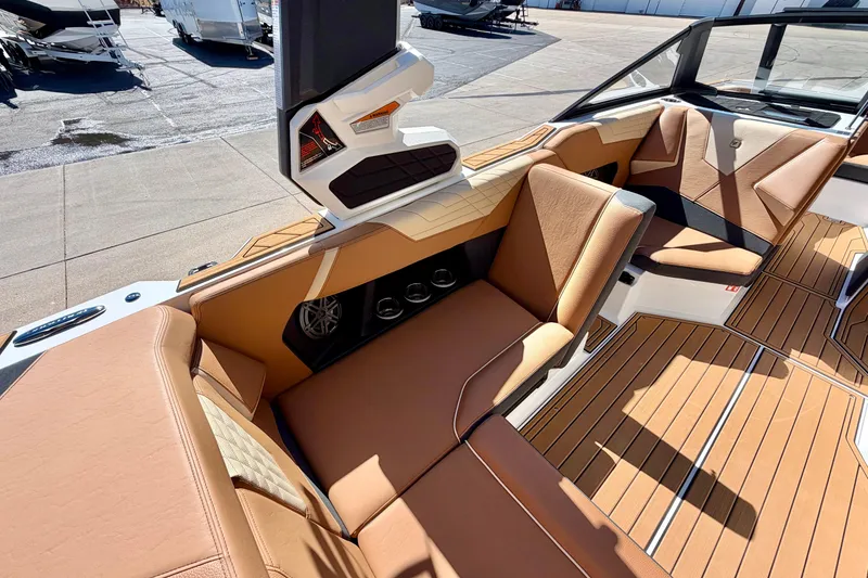 Slide: The Image of Luxurious interior of 2026 Nautique Super Air Nautique S21 boat with tan seating. - 20