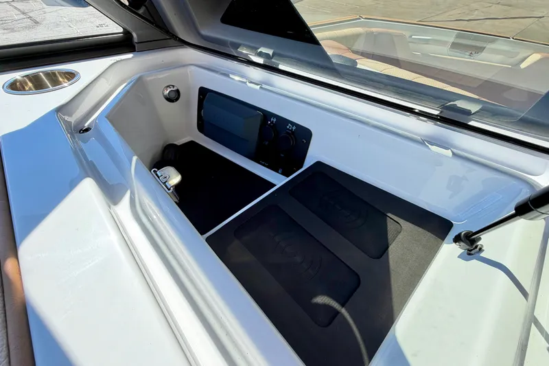 Slide: The Image of 2026 Nautique Super Air Nautique S21 storage compartment with sleek design and modern features. - 24