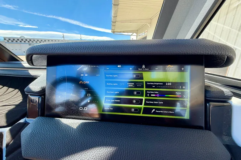 Slide: The Image of Touchscreen control panel in 2026 Nautique Super Air Nautique S21 boat cockpit. - 27