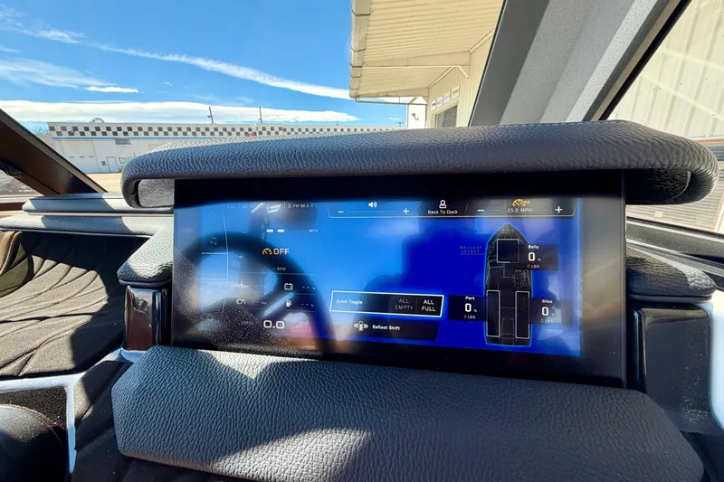 Slide: The Image of 2026 Nautique Super Air Nautique S21 dashboard display with ballast control interface. - 28