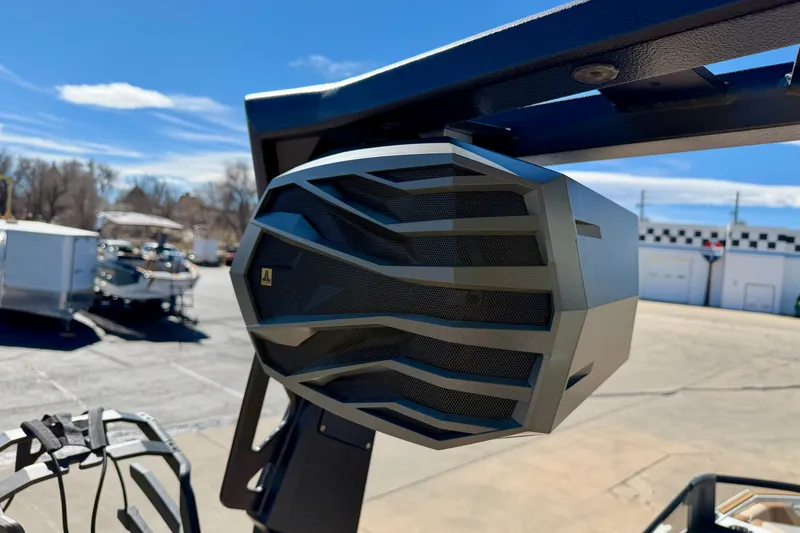 Slide: The Image of 2026 Nautique Super Air Nautique S21 boat speaker, sleek design under clear blue sky. - 33