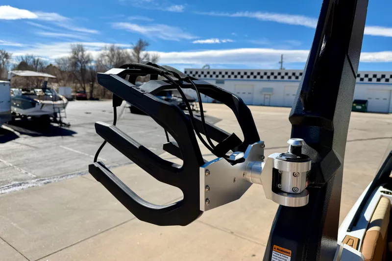 Slide: The Image of 2026 Nautique Super Air Nautique S21 wakeboard rack in a sunny outdoor setting. - 34