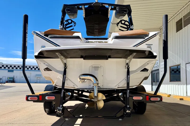 Slide: The Image of 2026 Nautique Super Air Nautique S21 boat on trailer, rear view. - 5