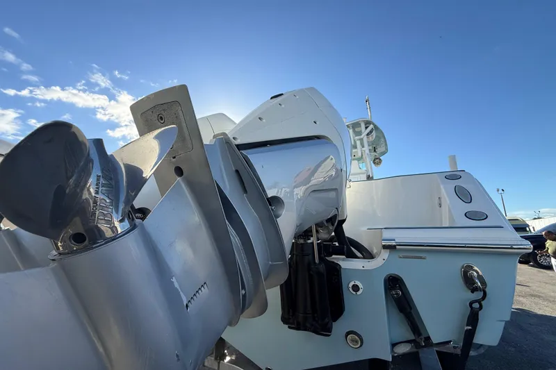 Slide: The Image of 2017 Tidewater 280 CC Adventure boat with powerful outboard motor under clear blue sky. - 19