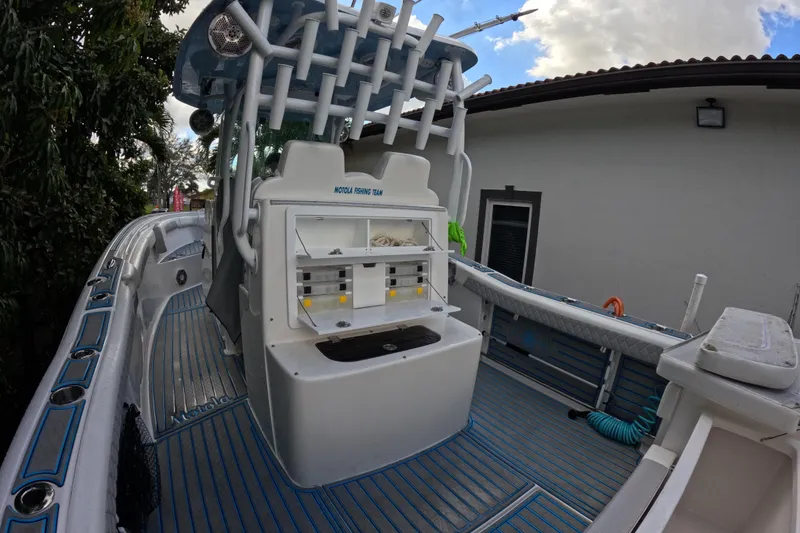 Slide: The Image of 2017 Tidewater 280 CC Adventure boat interior with fishing equipment and storage. - 2