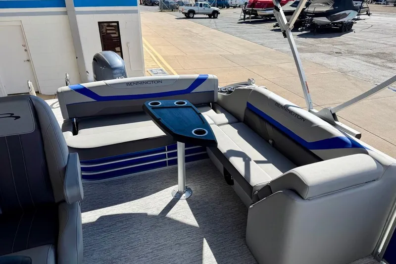 Slide: The Image of 2026 Bennington 22 SX Swingback boat interior with seating and table. - 14