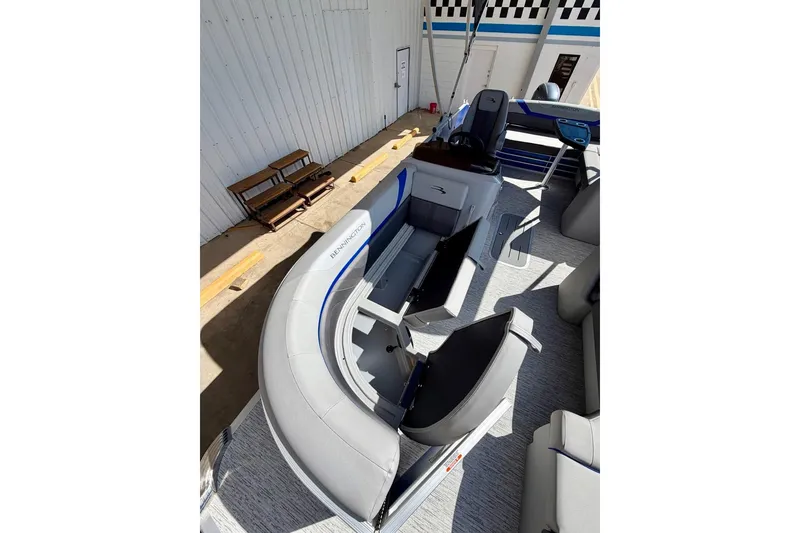 Slide: The Image of 2026 Bennington 22 SX Swingback pontoon boat interior with gray seating and helm. - 17