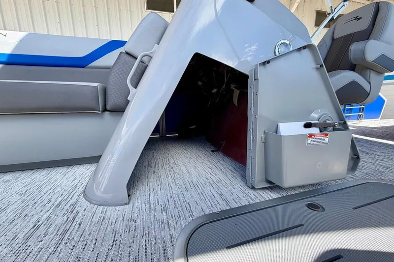 Slide: The Image of 2026 Bennington 22 SX Swingback boat interior with seating and storage compartment. - 20