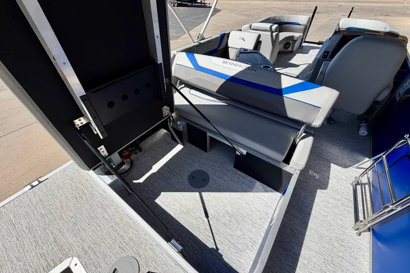 Slide: The Image of 2026 Bennington 22 SX Swingback interior with seating and storage features. - 24