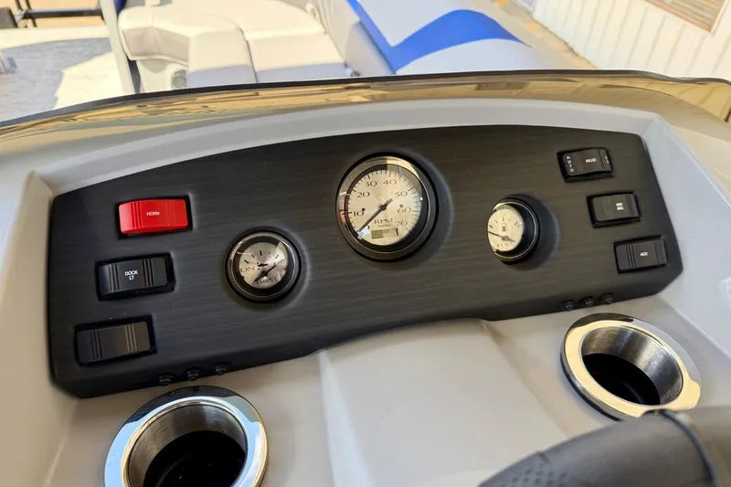 Slide: The Image of Dashboard of 2026 Bennington 22 SX Swingback boat with gauges and controls. - 25