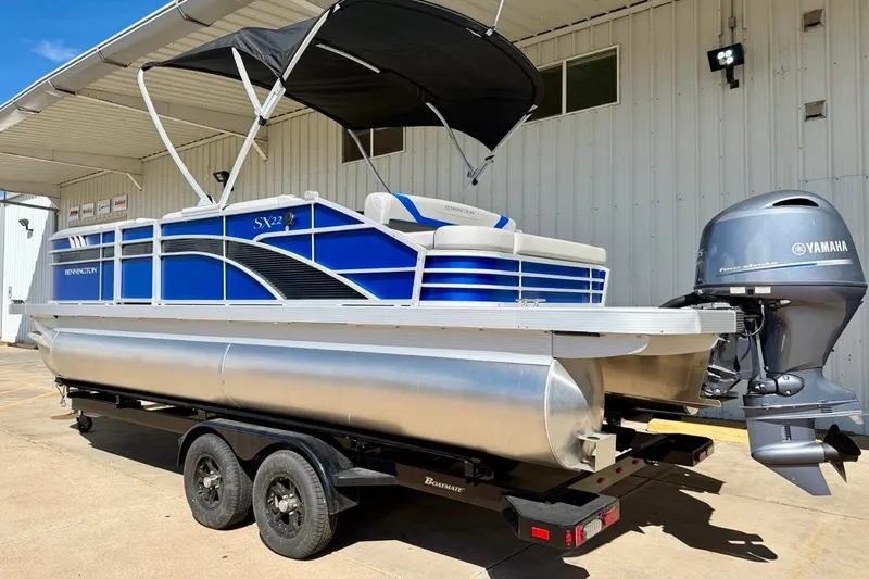 Slide: The Image of 2026 Bennington 22 SX Swingback pontoon boat with Yamaha motor on trailer. - 6