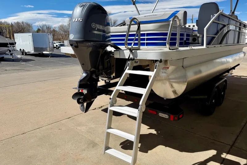 Slide: The Image of 2026 Bennington 22 SX Swingback pontoon boat with Yamaha 115 engine and ladder. - 8