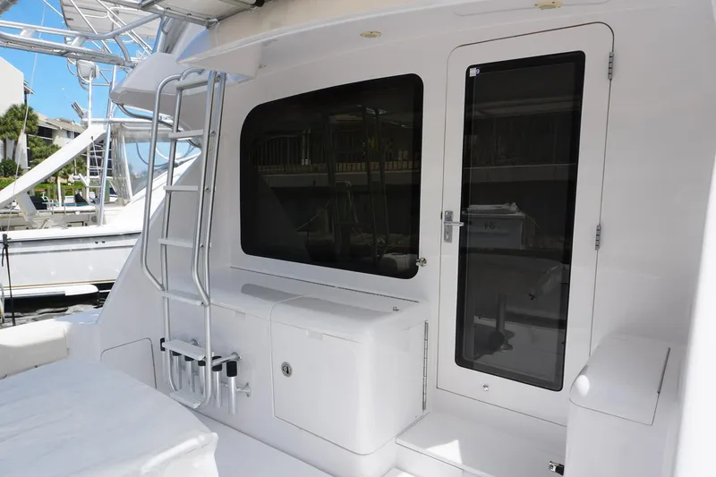 Slide: The Image of 2005 Mirage Yachts 40 Convertible boat deck with ladder and door. - 9
