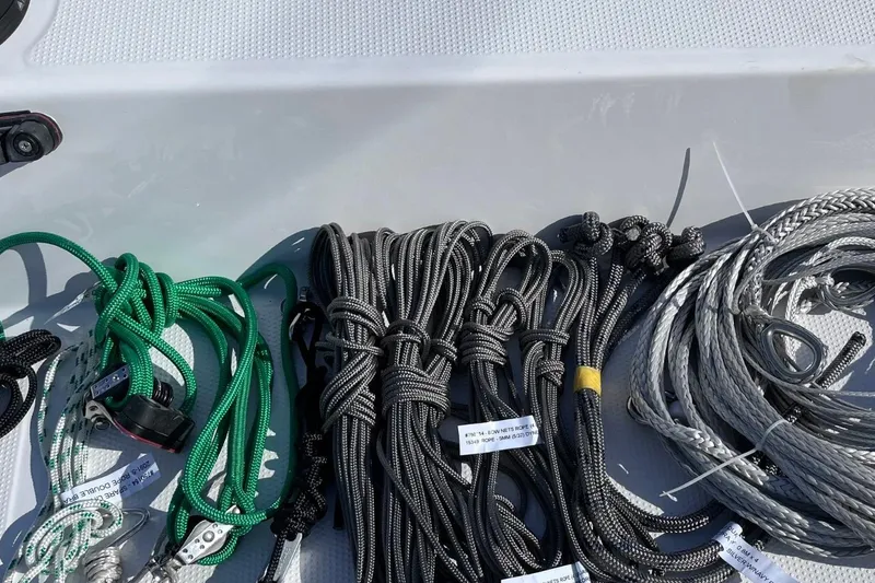 Slide: The Image of Assorted ropes and rigging on a 2022 Corsair 760 boat deck. - 10