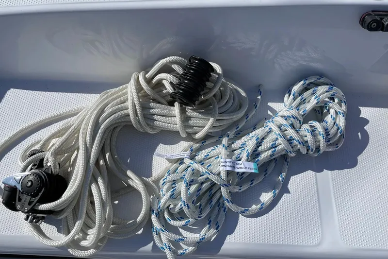 Slide: The Image of Coiled sailing ropes on a Corsair 760, 2022 model, with winch and label. - 11