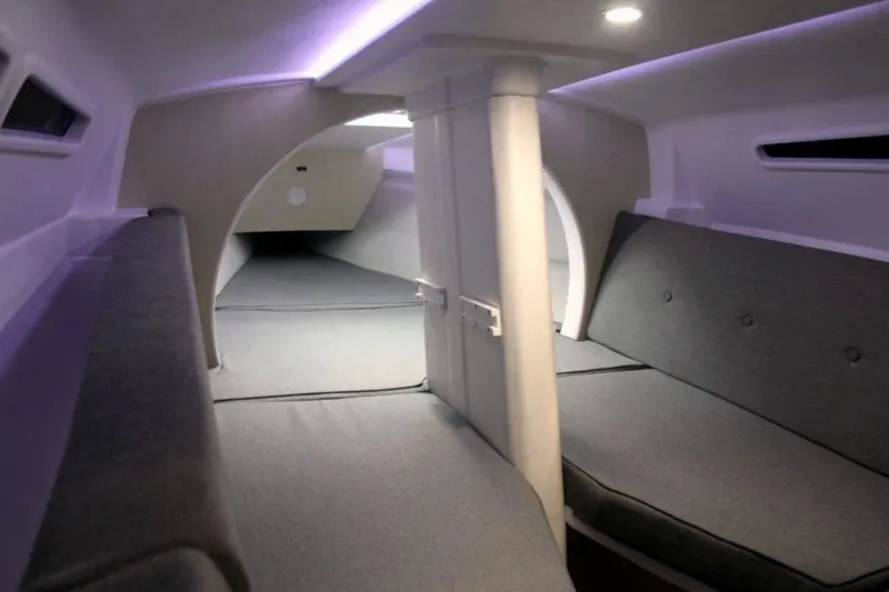 Slide: The Image of Interior of 2022 Corsair 760 sailboat, featuring modern seating and ambient lighting. - 2