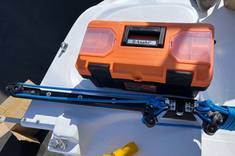 Slide: The Image of Orange toolbox on Corsair 760 boat, 2022 model, with blue rigging lines. - 9