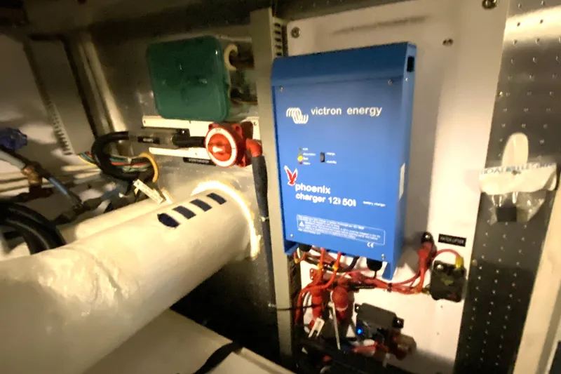 Slide: The Image of Electrical setup with Victron Energy Phoenix charger in Compass 55, year 2000. - 104