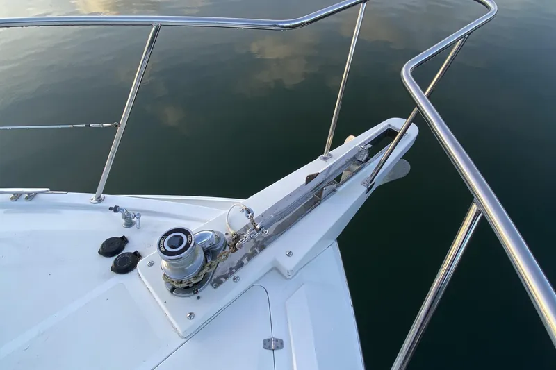 Slide: The Image of Bow of Compass 55 boat, 2000 model, with stainless steel railings and anchor winch. - 111