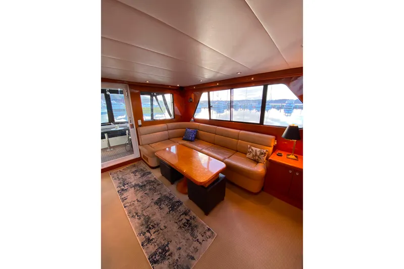 Slide: The Image of Luxurious interior of 2000 Compass 55 yacht with plush seating and elegant decor. - 14