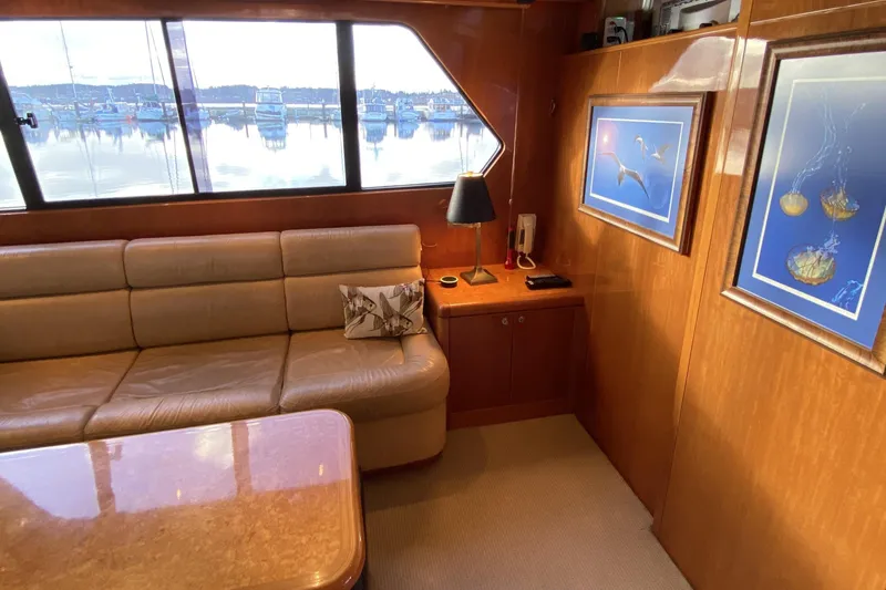 Slide: The Image of Luxurious interior of 2000 Compass 55 yacht with leather seating and nautical artwork. - 20