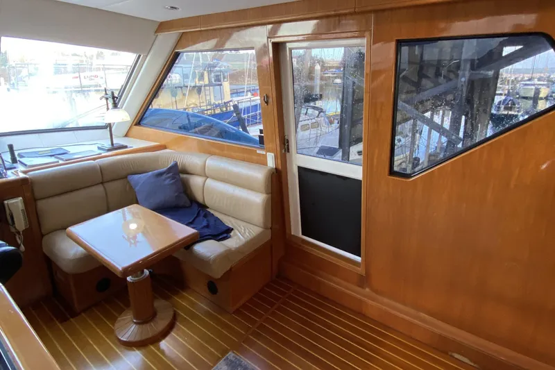 Slide: The Image of Luxurious interior of 2000 Compass 55 yacht with leather seating and wooden finishes. - 31