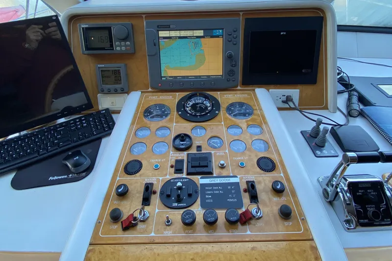 Slide: The Image of Control panel of a 2000 Compass 55 boat with navigation instruments and displays. - 40