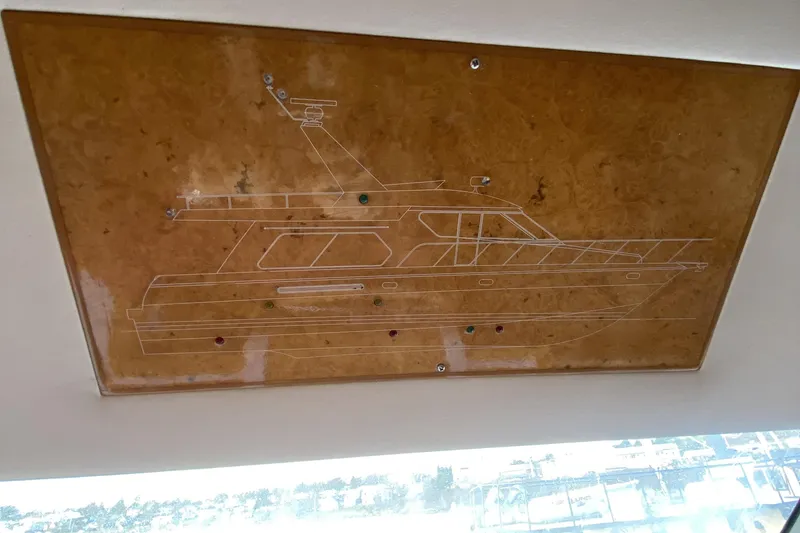Slide: The Image of Engraved schematic of a Compass 55 yacht from 2000 on a wooden panel. - 50