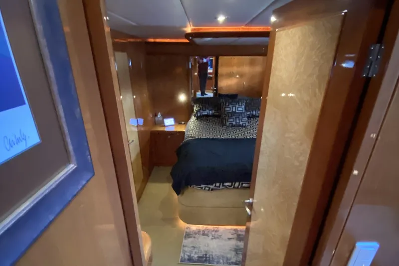 Slide: The Image of Luxurious cabin interior of 2000 Compass 55 yacht with elegant wood finishes. - 56